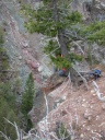 Dona on cliffs below falls