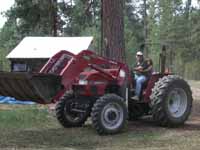 Eduardo and Dylan on Tractor