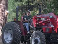 Eduardo and London on Tractor and Dylan in raft