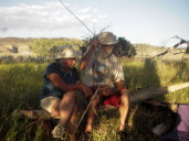 Gary helping Dona make a basket