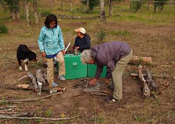 Dona and Zia starting a fire