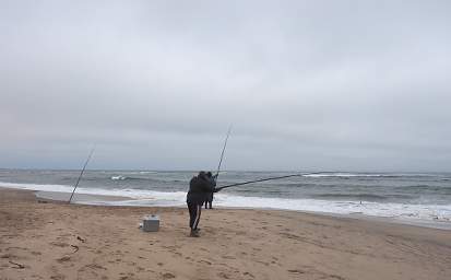 Fishermen Surfcasting