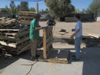 Everisto, Bob and Michelle taking pallets apart