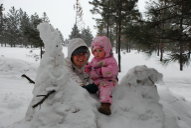 Dona and Mya on the snow dragon